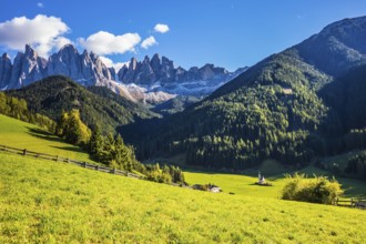 Little picturesque church of Santa Maddalena in Val di Funes. Sunny autumn day in Dolomites, Tirol.
