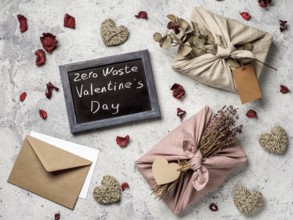 Zero waste Valentine's Day concept. Eco-friendly gift cloth wrapping in Furoshiki style and