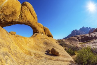 Picturesque stone arches are painted by iron oxides in red-orange color. Nature reserve Spitzkoppe