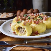 Polish dumplings with meat and mushroom sauerkraut filling