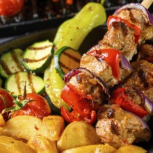 Shish kebab with various vegetables and spices Country potatoes