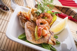 Shrimps with fish and vegetables