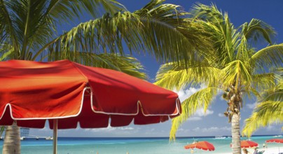 Red Beach Umbrellas and turquoise Waters of Caribbean, Grand Turk