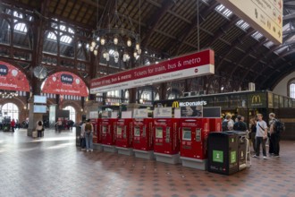 Copenhagen, Denmark, December 02, 2016: People inside the main hall of the Central Railway Station,