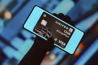 In this photo illustration, the United Club Infinite Card is displayed on a smartphone screen