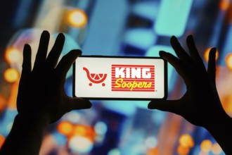In this photo illustration, the King Soopers logo seen displayed on a smartphone