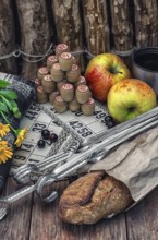 Accessories picnic consisting of peaches, apples and lotto games.Photo tinted