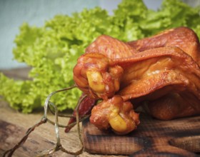 Smoked delicious chicken wings on the hardboard