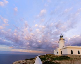 Menorca sunset in Faro Far de Caballeria Lighthouse at Balearic Islands es Mercadal