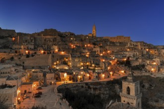 Matera, Italy, 26 November, 2023: view of the old town of Matera after sunset with the lights