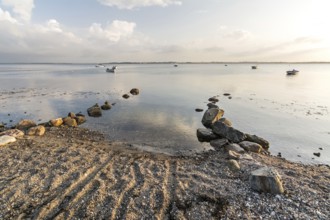 Natural boat ramp on a beach at the Baltic sea in peaceful morning light