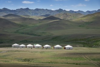 Traditional yurts between montains at sunset, Mongolia, Asia