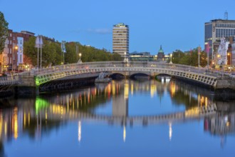 The River Liffey and the famous Ha'penny Bridge in Dublin, Ireland, at dusk, Europe