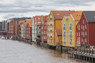 Colourful old timbered storehouses at the river Nidelva in Trondheim, Norway Colorful old timbered