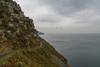 View of the narrow hiking trail on the coastal walk in the Valley of the Rocks in Exmoor in North