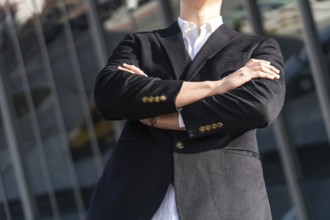 Photo of business man in classic black suit, shirt holding hands folded Achievement career wealth