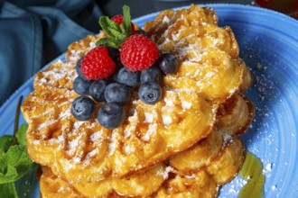 Simple sweet waffles with raspberries and blueberries