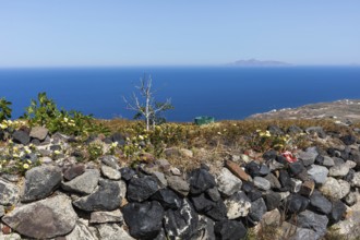 View from the crater hiking trail to an island in the sea, Santorini, Cyclades, Greece, Europe