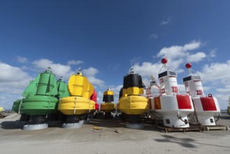 Colorful buoys in stock at the Dutch wadden island Terschelling
