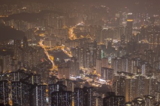 Residential Buildings in Hong Kong at Night. Panoramic Aerial View