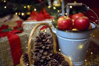 Christmas composition with red apples, gifts and gingerbread. Christmas in retro style. Vintage