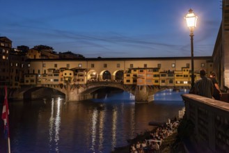 Famous Ponte Vecchio in Florence illuminated at night, Italy, Europe