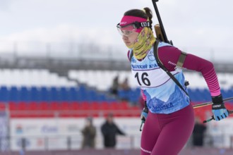 Kamchatka sportswoman biathlete Anastasia Ivchenko skiing on distance biathlon complex. Open