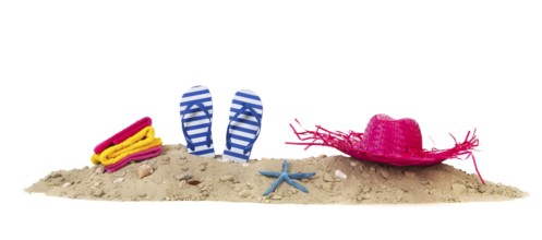 Beach with towels, flip flops and summer hat