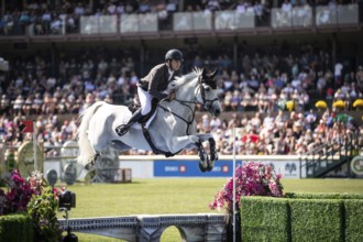 Donald Whitaker of Great Britain and riding Millfield Colette compete in the first round of the 1