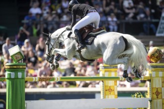 Martin Fuchs of Switzerland and riding Leone Jei compete in the first round of the 1.60m CPKC