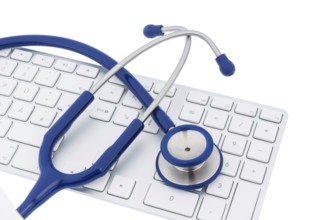 Stethoscope and keyboard of a computer, symbolic photo for diagnostics and appointment management