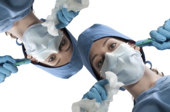 A beautiful young woman surgeon performing surgery