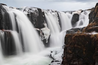 Closeup of Kolugljufur waterfall in Iceland in a cloudy day