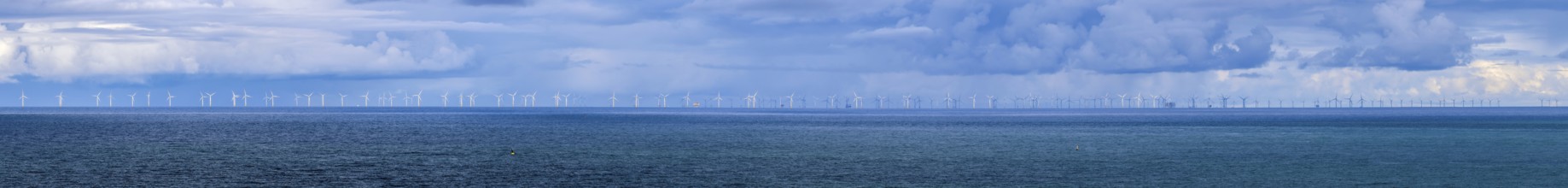 Panoramic photo offshore wind farm in the middle of the deep blue North Sea, photographed from