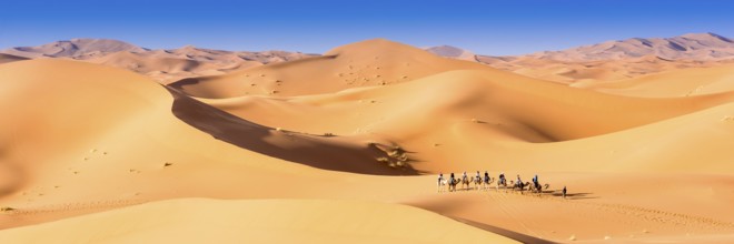Merzouga in the Sahara Desert in Morocco. Afica. Web banner in panoramic view