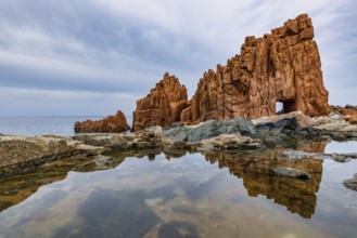 Rocce Rosse, the red rocks of Arbatax are reflected in a tidal pool, Arbatax, Tortoli, Ogliastra,