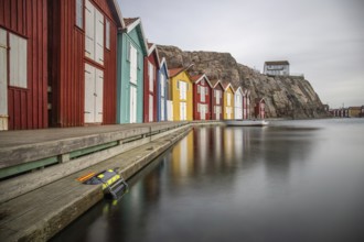 Small colourful houses by the sea. Typical houses in Sweden for the coastal landscape. Crab fishing