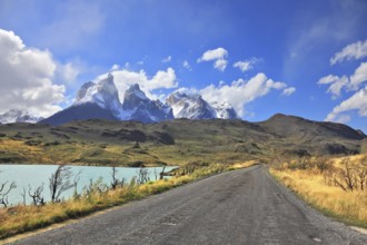 The gravel road along the shore of Lake Pehoe. The National Park Torres del Paine in Chile. In the