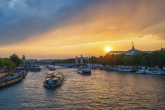 Paris France, city skyline sunset at Seine River with Pont Alexandre III bridge and Grand Palais