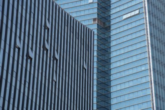 Modern glass skyscraper office building with open windows