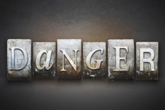 The word DANGER written in vintage letterpress type