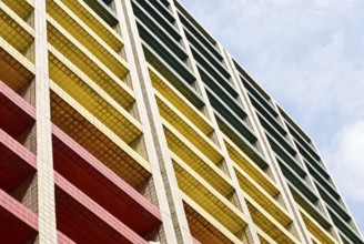 Colorful geometric building against a blue sky with a modern architectural design