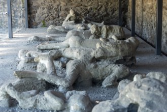 POMPEII, ITALY, MAY 04, 2022, Pompeiian inhabitants petrified in their last situation of life,