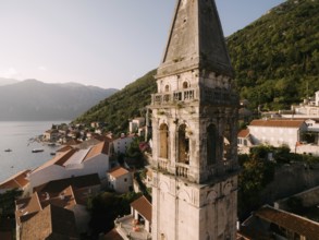 Bell tower of the Church of St. Nicholas in Perast. Montenegro. Drone.
