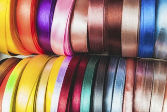 The many-coloured ribbon spools in the craft
