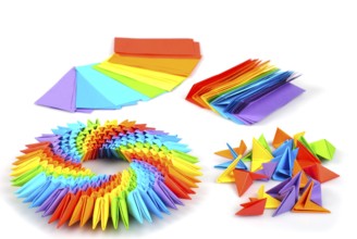 Colorfull origami 3d units like a rainbow circle isolated on white with shadow. From sheets of