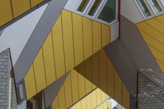 Section of a modern building with yellow panels and geometric shapes, rotterdam, the netherlands