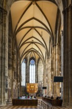 Vienna, Austria, 22 September, 2022: people praying during a church service in one of the side