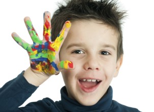 Boy hands painted with colorful paint. White islated smiling child