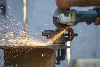 An image of a flex cutting metal with sparks